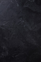 Natural black stone background pattern with high resolution. Top view. Copy space.