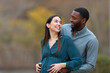 © PheelingsMedia - Interracial couple looking each other enjoying pregnancy