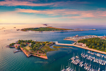 Sunset on Adriatic sea. Aerial summer view from flying drone of San Felice fortress, Italy, Europe. Traveling concept background.