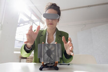 Female Engineer Developing New Technology Using Virtual Reality Simulator