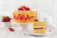 Piece Of French Fraisier Cake. Fruitcake Made With Two Layer Of Genoise Sponge, Diplomat Cream, Strawberry Jelly Layer And Fresh Strawberries.
