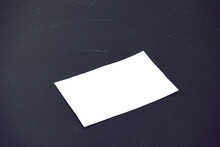 Simple Mockup Of A White Business Card Against Black Blackboard Background