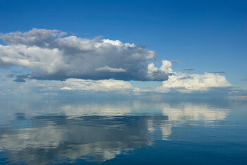 Wall Mural - sky and water. a calm landscape of clouds reflecting in the water
