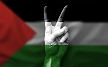 Hand Making The V Victory Sign With Flag Of Palestine