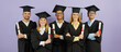 © Studio Romantic - Diverse group of happy proud mixed race university students in graduate mortarboard hats and robes, with diploma scrolls standing arms crossed on purple color background. Banner. Graduation concept