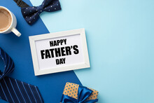 Father's Day Concept. Top View Photo Of White Photo Frame Polka Dot Giftbox With Blue Ribbon Bow Cup Of Coffee Bow-tie And Necktie On Bicolor Blue Background With Copyspace