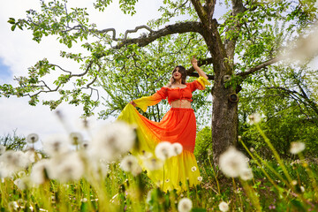 Young woman in apple orchard