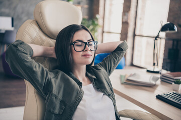 Poster - Photo of young pretty girl relax armchair dream asleep arms behind head finish project eyewear indoors