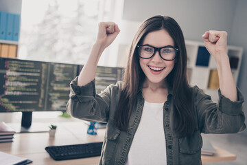 Poster - Portrait of beautiful cheerful lucky girl expert rejoicing having fun great luck at workplace workstation indoors