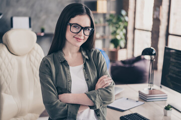 Poster - Portrait of attractive cheery girl folded arms web developer tech support service provider at workplace workstation indoors