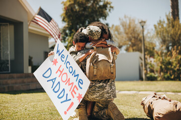 Wall Mural - Serviceman reuniting with his family after returning home