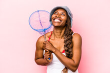 Young African American Woman Holding Fishing Net Isolated On Pink Background