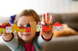 © Austockphoto - Housing affordability with a family concept shown with child holding blocks of coloured homes