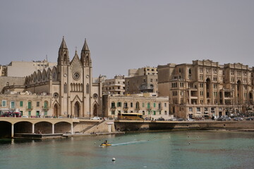 skyline of St Julians, Malta with the knisja tal-karmnu church on a sunny day