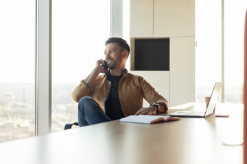 Aufkleber - Successful Businessman Talking On Phone Sitting At Workplace In Office