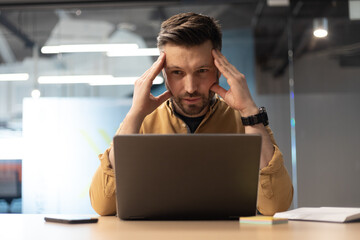 Canvas Print - Businessman Using Laptop Suffering From Headache Having Problems In Office