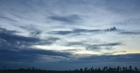 Wall Mural - Black clouds formed a storm in the sky among the water.