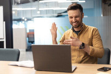 Poster - Cheerful Entrepreneur Making Video Call Talking To Laptop At Workplace