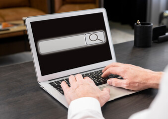 Poster - Businessman working on laptop and searching information on Internet. Screen with search bar icon. Man hands at keyboard closeup typing keywords. High quality photo