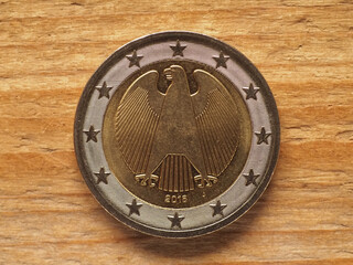 Wall Mural - 2 Euro coin showing federal eagle, currency of Germany, EU