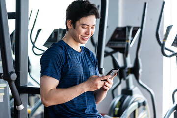 Young man in sportswear exercising at the gym