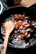 Bacon Frying In Black Skillet