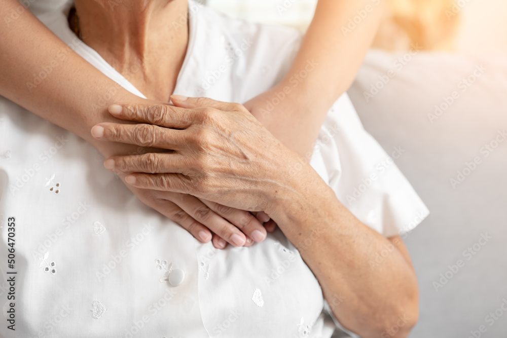 Young and senior woman holding each other hands togetherness concept ...