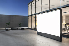 Side View On Outdoor Blank White Billboard On Grey Floor And Stylish Street Benches Near Modern Business Center Building With Glass Walls In The Evening. 3D Rendering, Mockup