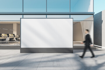 Aufkleber - businessman passing by big blank white billboard on light grey ceramic tale floor on a street near m