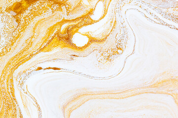 Gold liquid marble background. Used in design for skin tile ,wallpaper, interiors backdrop. Picture high resolution. Luxurious background