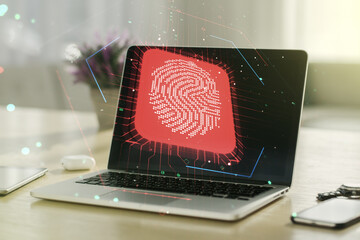 Poster - Multi exposure of creative fingerprint hologram on laptop background, personal biometric data concept
