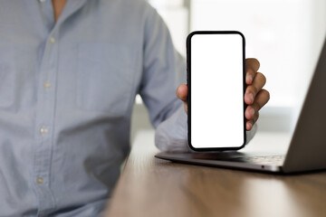 Wall Mural - Top view mockup  man sitting and holding blank screen  lifestyle technology and Social media network