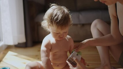 carefree healthy fit young adult asian mom and child boy having fun play bear together, happy asian 