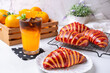 Orange americano coffee and Raspberry croissant is ready to serve in the morning, refreshing.