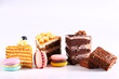 assortment of cakes desserts on white background