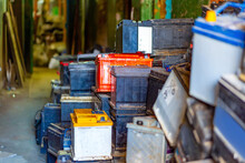 Discarded Old Car Batteries In A Garage For Recycling In A Lead Scrap Yard. Selective Focus.