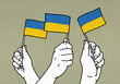 © fStop - Hands waving Flags of Ukraine