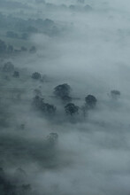 Scenic Aerial View Fog Over Valley Landscape With Trees, Castleton, Derbyshire, England
