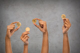 Fototapeta Kawa jest smaczna - cryptocurrency, finance and business concept - close up of female hands holding golden bitcoin over grey stone background