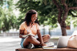 © Syda Productions - technology, education and people concept - happy smiling african american student girl with notebook, laptop computer and books in city