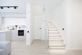 Fototapeta Konie - Illuminated wooden staircase in duplex apartment