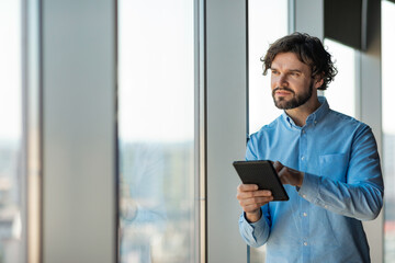 Aufkleber - Portrait of man using digital tablet at office