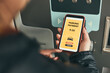 © Przemek Klos - Woman paying for parking ticket at car parking payment machine using mobile app on smartphone. Car parking application on mobile phone