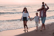© .shock - Family have fun and live healthy lifestyle on beach. Selective focus