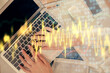 © peshkova - Double exposure of woman hands working on computer and forex chart hologram drawing. Top View. Financial analysis concept.