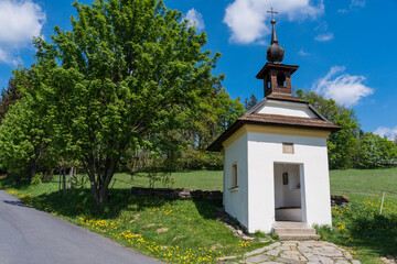 baroque chapel with wooden roof in beautiful green nature