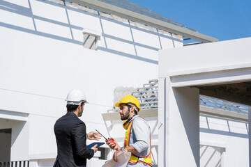Poster - Engineer with business manager are talking in construction site,Project owner with blueprint working to new residential home building work site.