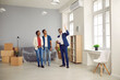 © Studio Romantic - Interracial married couple looking for new home. Real estate agent giving house tour to potential buyers. Realtor showing modern big spacious flat to young boyfriend and girlfriend or husband and wife