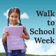 Composite of portrait of smiling asian girl with book and walk to school week text against blue sky