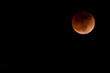 Moon and stars in the sky during the total moon eclipse May 15, 2022